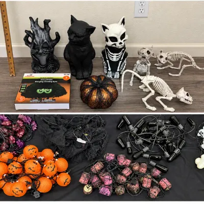 Collection of Halloween decor, including cat and tree figurines, skeleton figures, a glitter pumpkin, glow-in-the-dark eyes, and multiple...