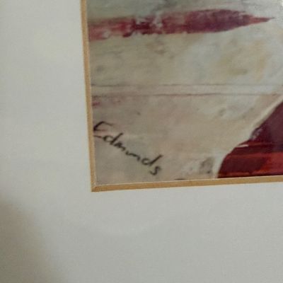 Close-up detail of an artist's signature reading 'Edmonds' on a framed original painting.