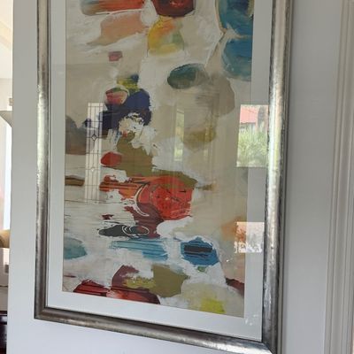 Large abstract expressionist framed print featuring colorful geometric and organic shapes in a silver metallic frame.