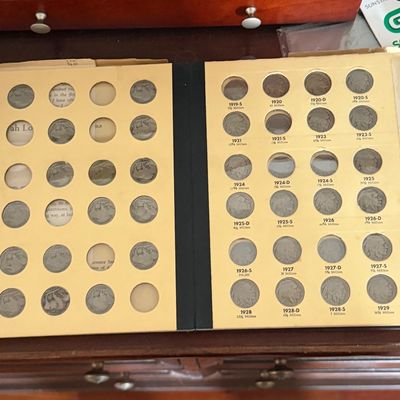 Vintage Whitman Buffalo nickel coin album, partially filled with US five-cent pieces.