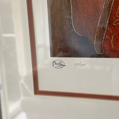 Close-up of a framed Alphonse Mucha Foundation art print, hand-numbered 132/475 with double matting.