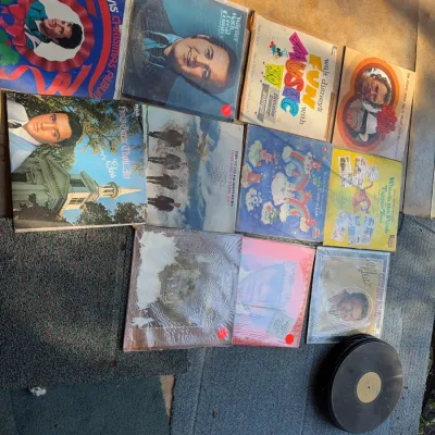 Sale Photo Thumbnail #98: Collection of vintage vinyl LP records featuring titles by Elvis Presley, Johnny Mathis, and Disney, along with a stack of loose records.