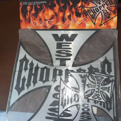 Sale Photo Thumbnail #182: Sealed West Coast Choppers Jesse James die-cut sticker pack featuring the iconic Iron Cross branding, in new condition.