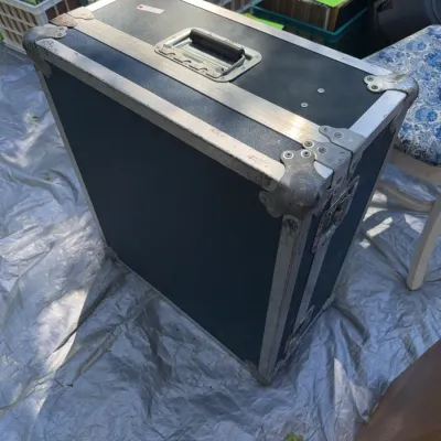 Sale Photo Thumbnail #45: Heavy-duty road case with reinforced metal corners, aluminum trim, and a top carrying handle.