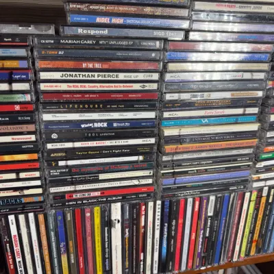 Sale Photo Thumbnail #119: Large collection of 1990s and 2000s music CDs in jewel cases, featuring various rock, pop, and R&B artists.