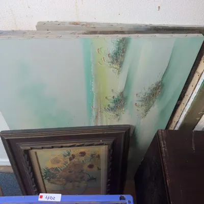 Sale Photo Thumbnail #176: Assorted artwork, including a large unframed coastal dune canvas painting and a framed Van Gogh sunflower print.