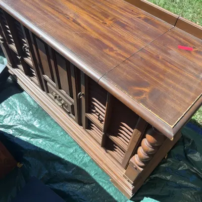 Sale Photo Thumbnail #57: Vintage dark wood console stereo cabinet featuring louvered door details and turned corner posts.