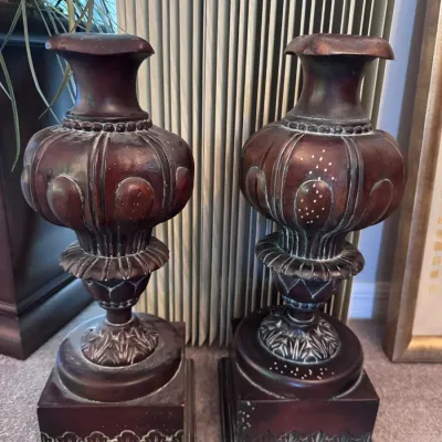 Pair of ornate traditional mahogany pedestals with flared tops and square molded bases.