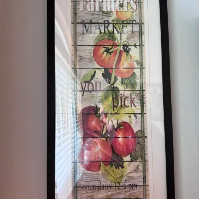 Sale Photo Thumbnail #143: Framed rustic 'Farmers Market' wall art featuring a tomato illustration on a faux wood slat background with a black frame.