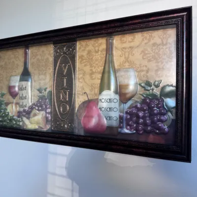 Sale Photo Thumbnail #144: Framed wine-themed Tuscan wall art piece with embossed foil details, bottles, grapes, and 'VINO' lettering in a dark molded frame.