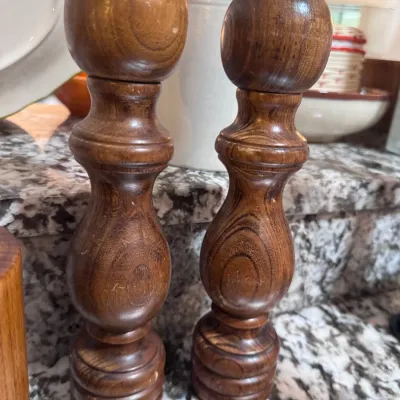 Sale Photo Thumbnail #121: Pair of vintage turned wood salt shaker and pepper grinder set with a rich natural grain finish.