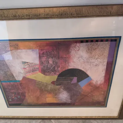Sale Photo Thumbnail #109: Framed mixed media abstract collage featuring geometric shapes and textured patterns in an ornate gold-finished wood frame.