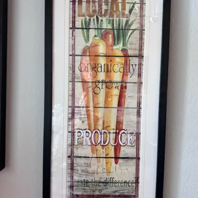 Sale Photo Thumbnail #142: Framed wall art featuring a rustic vintage-style print of carrots with text reading "Local Organically Grown Produce."