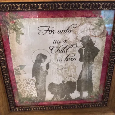 Sale Photo Thumbnail #111: Framed Christian Christmas wall art depicting a Nativity scene with scripture from Isaiah 9:6, housed in a ornate gold-tone frame.