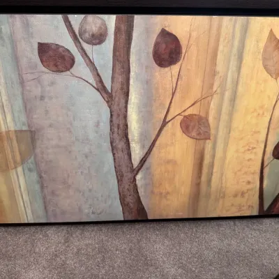 Sale Photo Thumbnail #114: Large contemporary framed canvas painting featuring abstract stylized tree trunks and leaves in earth tones.