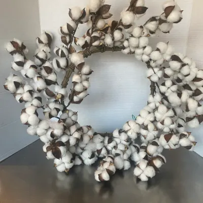 Sale Photo Thumbnail #13: Rustic cotton boll decorative wreath with natural brown husks and full fluffy cotton fibers.