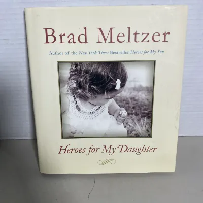 Sale Photo Thumbnail #104: Hardcover copy of "Heroes for My Daughter" by Brad Meltzer, featuring original dust jacket.