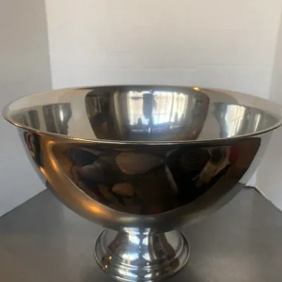 Sale Photo Thumbnail #15: Polished silver-toned metal punch bowl or wine cooler featuring a pedestal base and mirror finish.