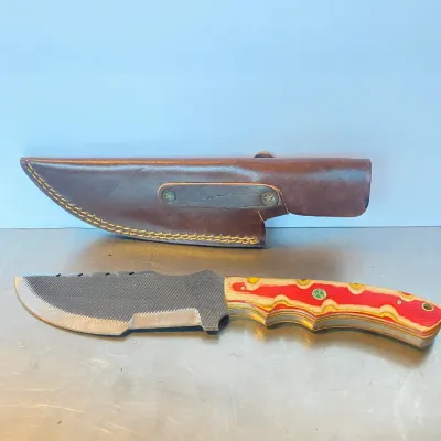 Sale Photo Thumbnail #56: Custom file knife with a colorful laminated wood handle, accompanied by a fitted brown leather sheath.