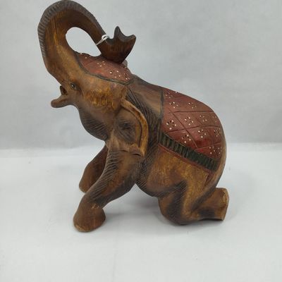 Sale Photo Thumbnail #199: Carved Wood Kneeling Elephant Figurine