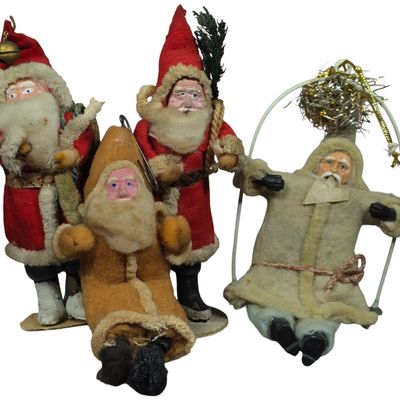 Sale Photo Thumbnail #100: A Collection of Four Vintage Cotton Batting and Felt Santa Claus Figurines