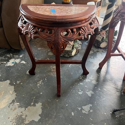 Sale Photo Thumbnail #5: Ornately carved Chinese-style demi-lune accent table featuring a marble inlay top and cabriole legs with cross stretchers.