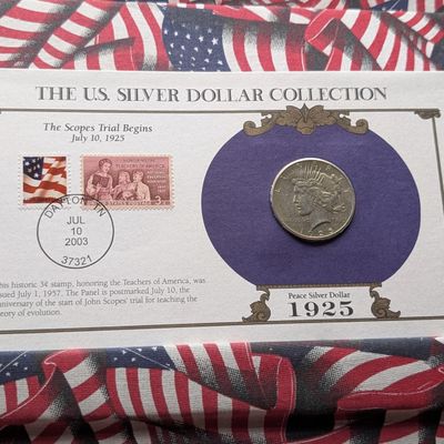 Sale Photo Thumbnail #232: 1925 Peace 90% Silver Dollar and Stamp In Collection Card