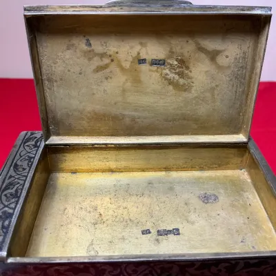 Open Russian 84 silver niello trinket box featuring a gilded interior and engraved floral niello detail along the border. Silver...