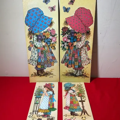 Set of four vintage 1970s Holly Hobbie-style wooden wall plaques featuring illustrations of young girls in sunbonnets by artist Amy.