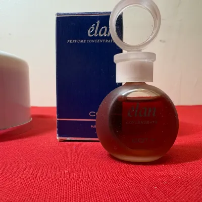 Vintage Coty Élan perfume concentrate miniature glass bottle with a ring stopper, complete with its original blue box.