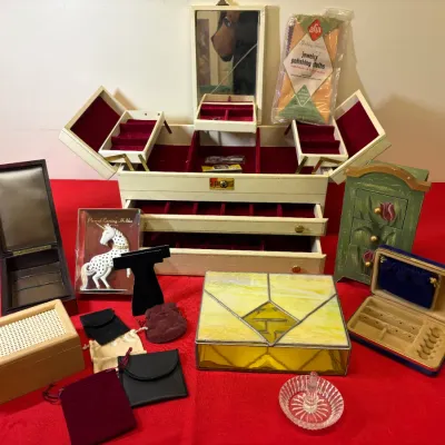 Collection of vintage jewelry boxes and accessories, featuring a large multi-tiered cream leatherette cantilever box with mirror, a...