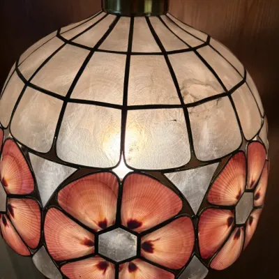 Vintage capiz shell pendant light fixture featuring pink seashell floral motifs and leaded panel design, circa 1970s.