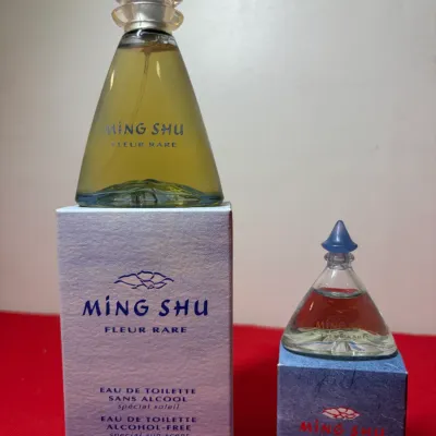 Yves Rocher Ming Shu Fleur Rare eau de toilette perfume set, featuring a 50 ml spray bottle with original box and a matching 7.5 ml...