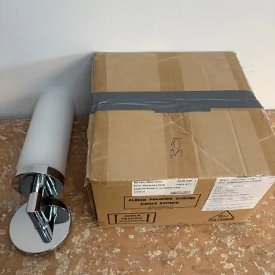 Sale Photo Thumbnail #81: Restoration Hardware Albion single sconce in polished chrome, displayed next to its original shipping box.