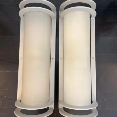 Sale Photo Thumbnail #14: Pair of modern brushed metal cylindrical wall sconces with frosted glass diffusers.