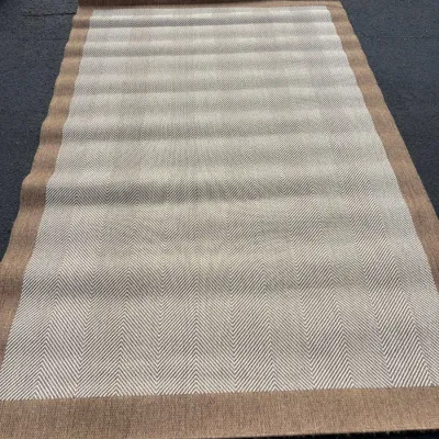 Sale Photo Thumbnail #77: Large beige and tan woven area rug with a herringbone pattern and solid border, displayed flat outdoors.