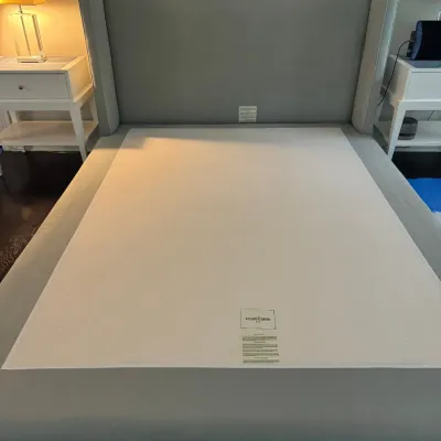 Sale Photo Thumbnail #62: Williams Sonoma contemporary upholstered wingback bed frame with tall headboard and integrated platform base in light gray fabric.