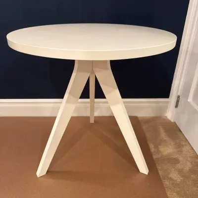 Sale Photo Thumbnail #11: Modern white round side table with flared tripod legs.