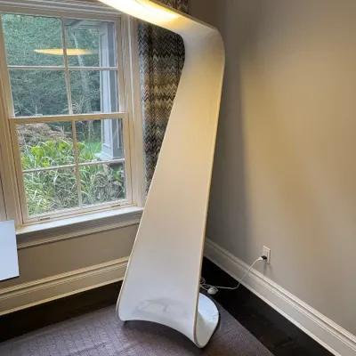 Sale Photo Thumbnail #24: Modern sculptural white floor lamp featuring a curved, ribbon-like organic silhouette with integrated top lighting.