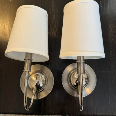 Sale Photo Thumbnail #44: Pair of contemporary brushed nickel wall sconces with white fabric lampshades.