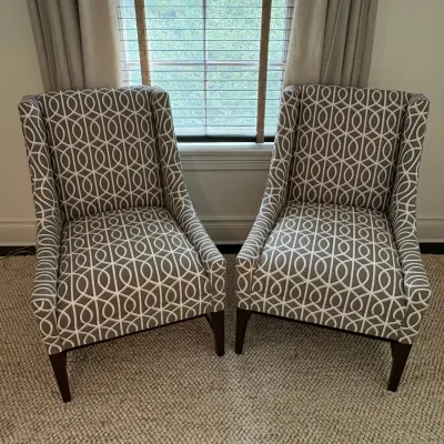 Sale Photo Thumbnail #49: Pair of contemporary upholstered accent chairs with a gray and white geometric ring pattern and dark wood legs.