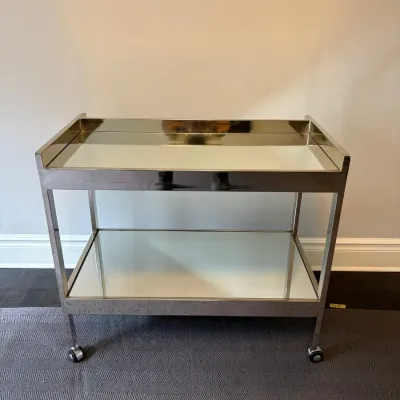 Sale Photo Thumbnail #33: Mid-century modern chrome bar cart with two mirrored shelves and caster wheels.