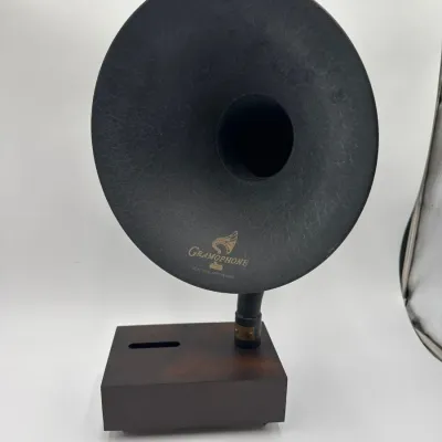 Sale Photo Thumbnail #82: Gramovox Bluetooth Gramophone speaker featuring a dark wood rectangular base and an iconic black horn bell.