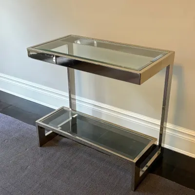 Sale Photo Thumbnail #35: Modern chrome-framed console table featuring clear glass inset panels on top and a lower tier.