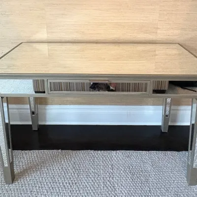 Sale Photo Thumbnail #48: Contemporary mirrored vanity desk featuring a single center drawer, mirrored panel legs, and a champagne metallic frame.