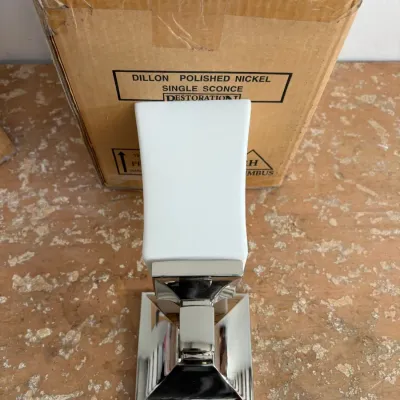Sale Photo Thumbnail #47: Restoration Hardware Dillon single sconce in polished nickel with a white frosted glass shade, shown with its original cardboard box.