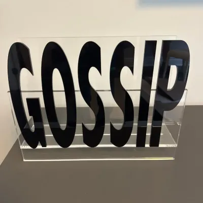 Sale Photo Thumbnail #26: Contemporary clear and black acrylic magazine holder featuring bold graphic lettering that spells out 'GOSSIP'.
