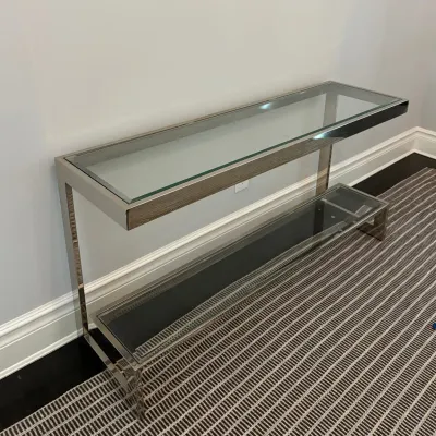 Sale Photo Thumbnail #38: Modern chrome-framed console table featuring a glass top and an offset lower glass tier.