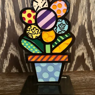 Sale Photo Thumbnail #61: Romero Britto pop art colorful flower sculpture mounted on a black square base.