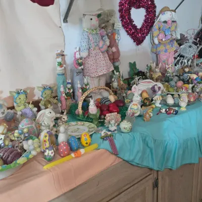 Sale Photo Thumbnail #25: Large collection of spring and Easter decor, featuring plush bunnies, decorative eggs, baskets, and holiday figurines.